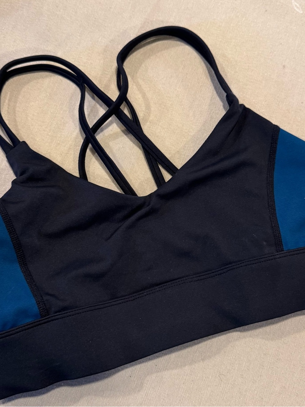 Black Sports Bra with Teal Side Panels and Strappy Back